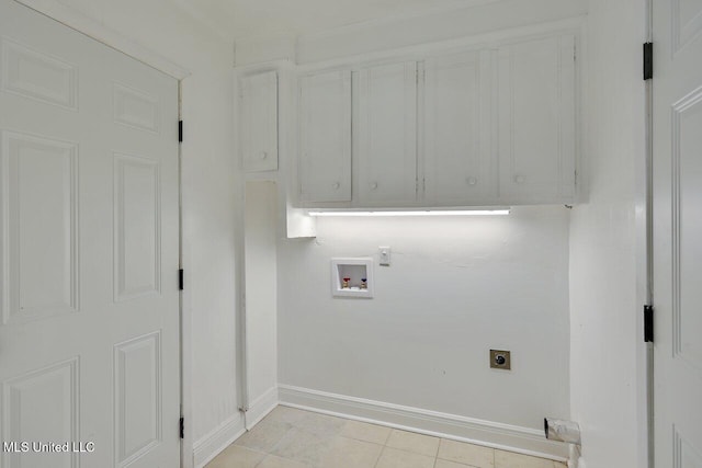 washroom featuring hookup for a washing machine, light tile patterned flooring, electric dryer hookup, and cabinets