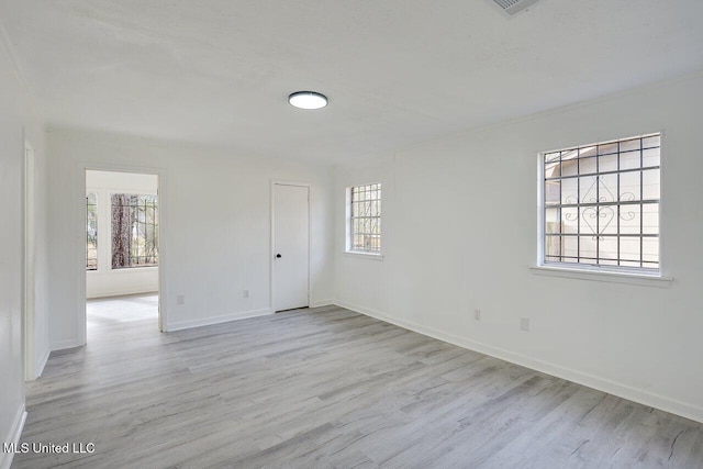 unfurnished room with light hardwood / wood-style flooring