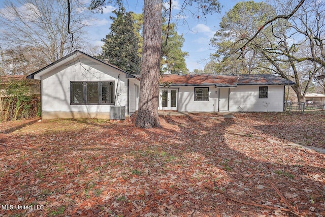 rear view of property with cooling unit