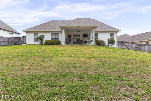 105 Camden Lake Cir, Madison, MS 39110 - back of house with ceiling fan, a fenced backyard, a patio area, brick siding, and roof with shingles
