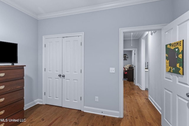 105 Camden Lake Cir, Madison, MS 39110 - unfurnished bedroom with attic access, wood finished floors, ornamental molding, and a closet