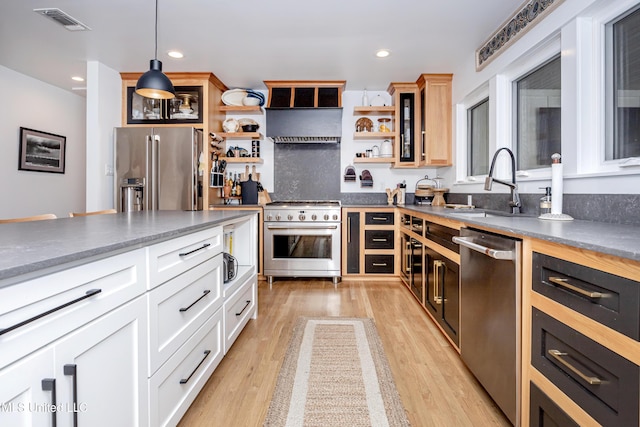 kitchen with decorative light fixtures, open shelves, visible vents, white cabinetry, and high quality appliances