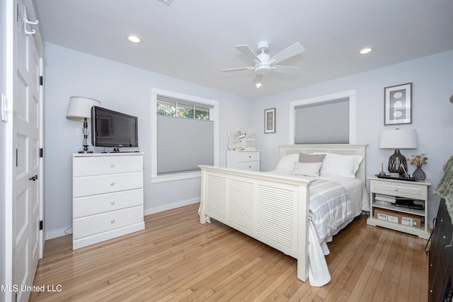 bedroom featuring a ceiling fan, light wood-type flooring, baseboards, and recessed lighting