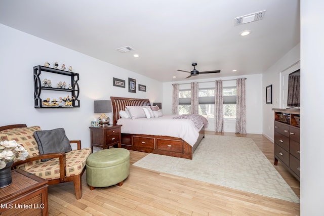 bedroom featuring ceiling fan, light wood-type flooring, and visible vents