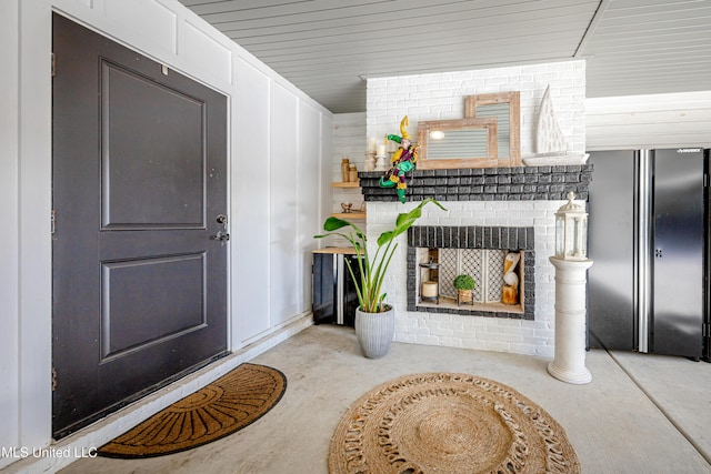 interior space with a fireplace and concrete flooring