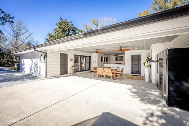 exterior space featuring outdoor dining space, ceiling fan, and a patio