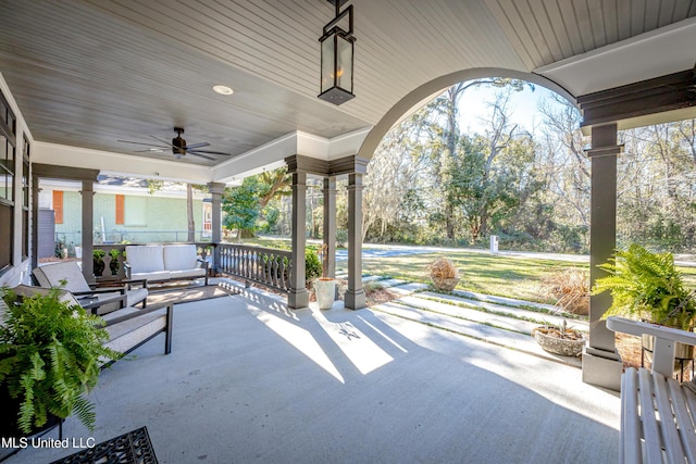 view of patio featuring a ceiling fan and a porch