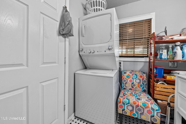 laundry area featuring stacked washer and dryer