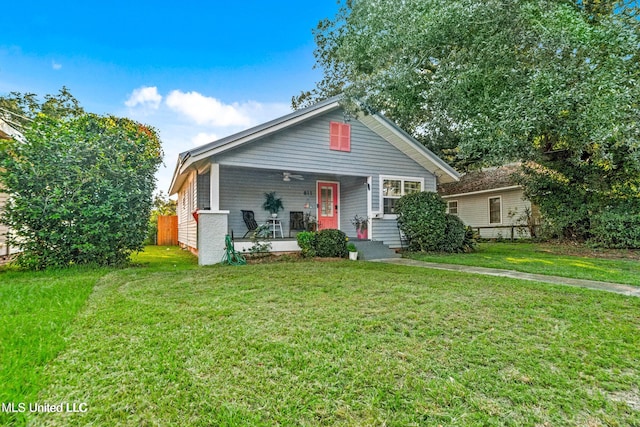 view of front of home featuring covered porch and a front yard