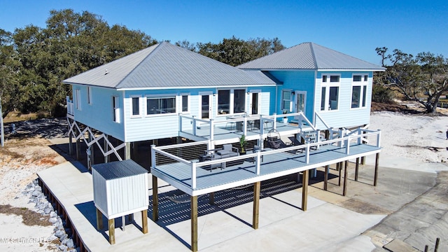 6717 Belle Fontaine Dr, Ocean Springs, MS 39564 - rear view of property with a deck and metal roof