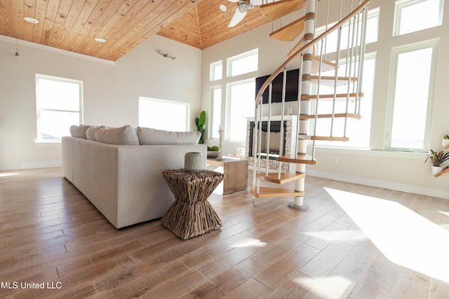 6717 Belle Fontaine Dr, Ocean Springs, MS 39564 - living room with stairway, wood ceiling, a ceiling fan, and wood finished floors