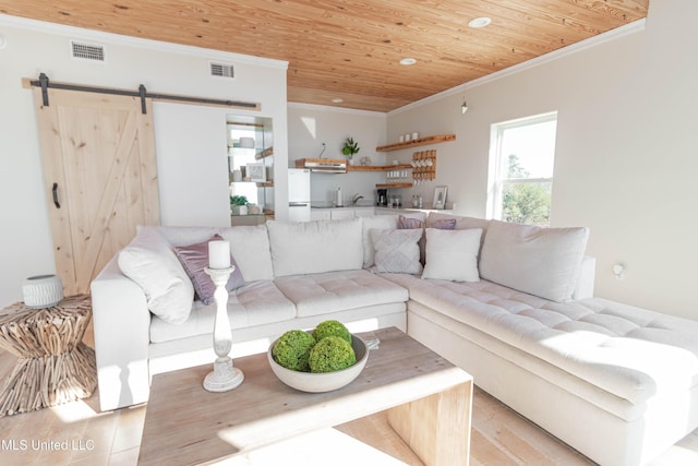 6717 Belle Fontaine Dr, Ocean Springs, MS 39564 - living area featuring wooden ceiling, ornamental molding, a barn door, and visible vents