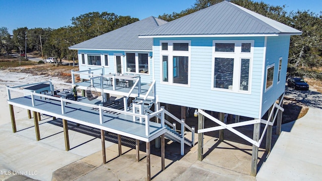 6717 Belle Fontaine Dr, Ocean Springs, MS 39564 - back of house with a deck and metal roof