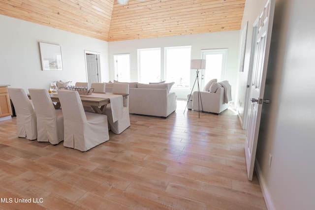 6717 Belle Fontaine Dr, Ocean Springs, MS 39564 - dining area featuring light wood-style floors and high vaulted ceiling