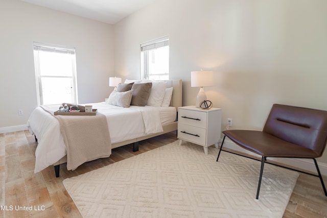 6717 Belle Fontaine Dr, Ocean Springs, MS 39564 - bedroom featuring baseboards and light wood-type flooring