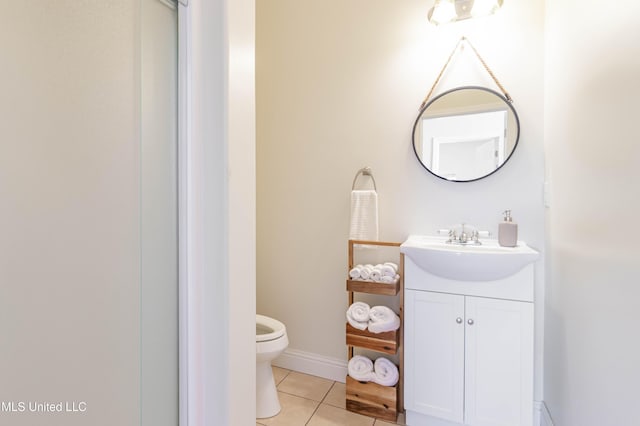 6717 Belle Fontaine Dr, Ocean Springs, MS 39564 - bathroom featuring vanity, tile patterned flooring, baseboards, and toilet