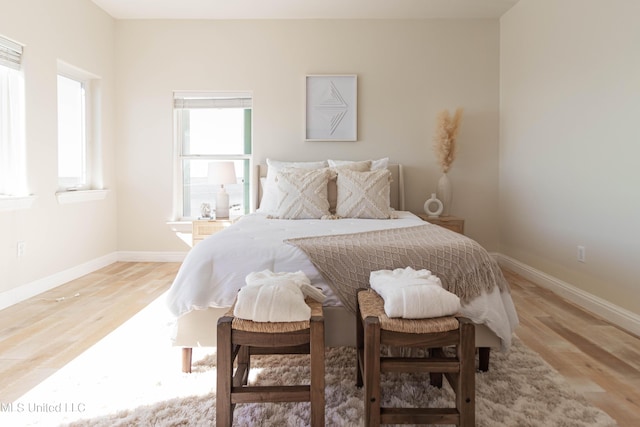 6717 Belle Fontaine Dr, Ocean Springs, MS 39564 - bedroom featuring baseboards and light wood finished floors