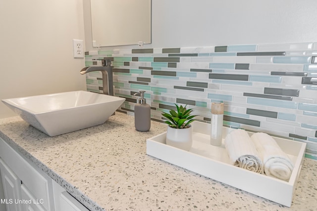 6717 Belle Fontaine Dr, Ocean Springs, MS 39564 - bathroom with a sink and tasteful backsplash