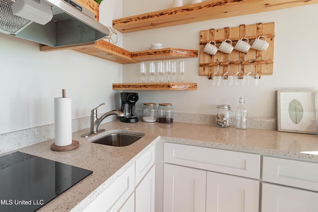 6717 Belle Fontaine Dr, Ocean Springs, MS 39564 - interior space with open shelves, a sink, white cabinets, black electric stovetop, and under cabinet range hood