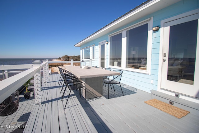 6717 Belle Fontaine Dr, Ocean Springs, MS 39564 - wooden deck with outdoor dining space and a water view
