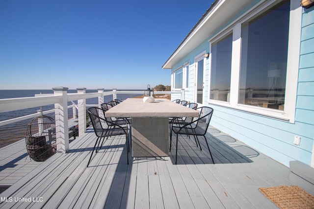 6717 Belle Fontaine Dr, Ocean Springs, MS 39564 - wooden deck with a water view and outdoor dining space