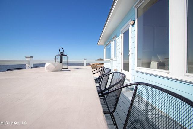 6717 Belle Fontaine Dr, Ocean Springs, MS 39564 - balcony featuring a water view and outdoor dining area