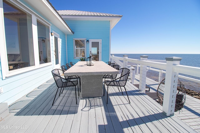 6717 Belle Fontaine Dr, Ocean Springs, MS 39564 - wooden deck featuring a water view and outdoor dining space