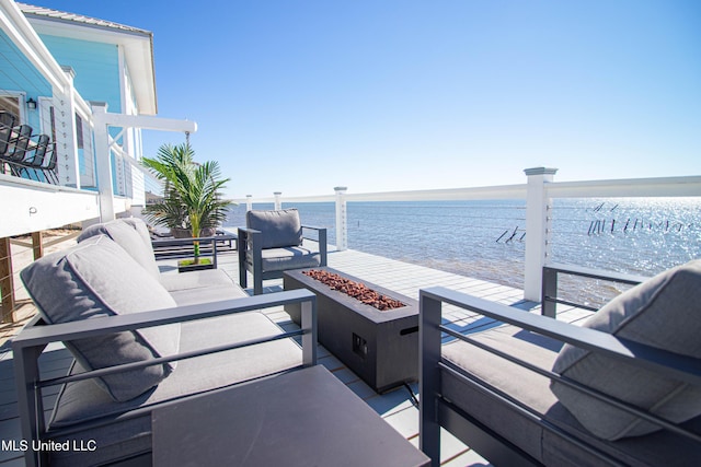 6717 Belle Fontaine Dr, Ocean Springs, MS 39564 - view of patio / terrace featuring a water view and an outdoor living space with a fire pit