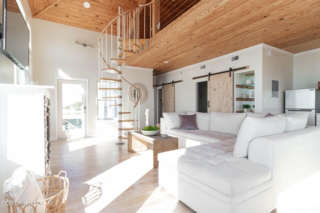6717 Belle Fontaine Dr, Ocean Springs, MS 39564 - living room featuring visible vents, a barn door, wood ceiling, and stairway