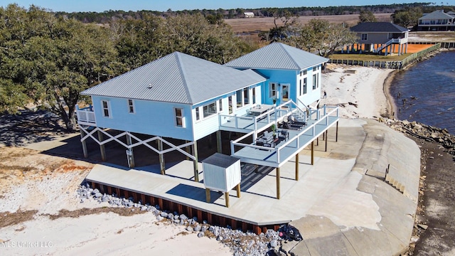 6717 Belle Fontaine Dr, Ocean Springs, MS 39564 - back of property featuring a deck with water view and metal roof