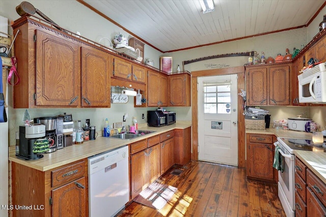 kitchen with white appliances, dark wood-type flooring, sink, crown molding, and wood ceiling