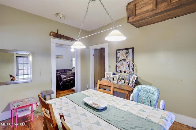 dining area with hardwood / wood-style flooring