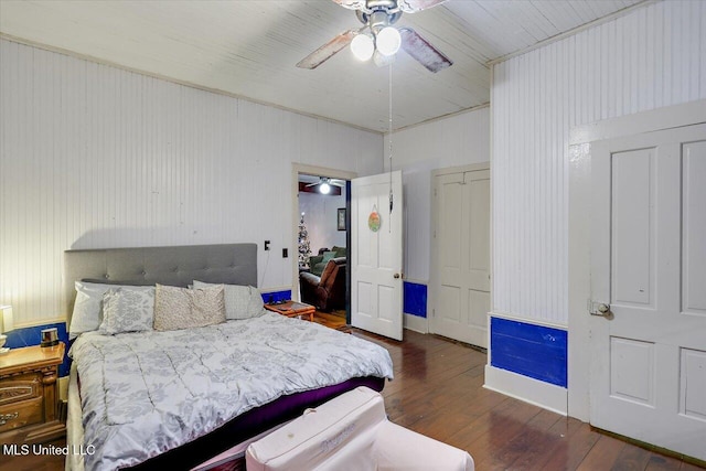 bedroom with ceiling fan and dark wood-type flooring