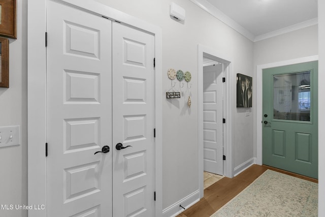 interior space with dark hardwood / wood-style flooring and crown molding