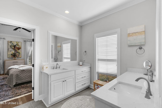 bathroom featuring vanity, ceiling fan, crown molding, and a wealth of natural light