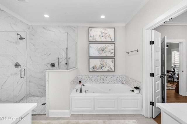 bathroom featuring plus walk in shower, vanity, and ornamental molding