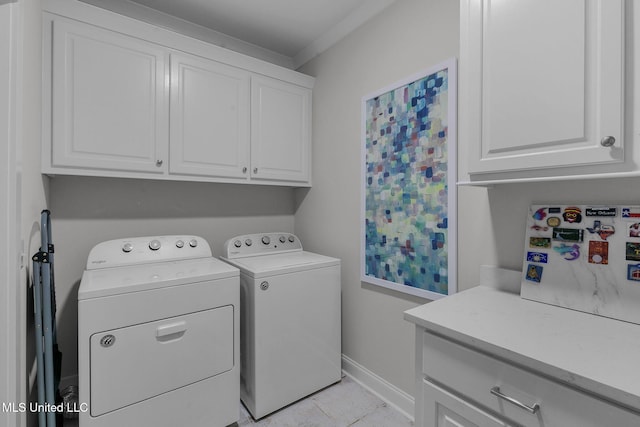 laundry area featuring separate washer and dryer, crown molding, light tile patterned flooring, and cabinets