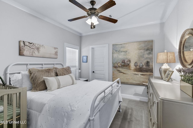 bedroom featuring ceiling fan, carpet, and ornamental molding