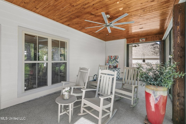 exterior space featuring a wealth of natural light, ceiling fan, and wooden ceiling