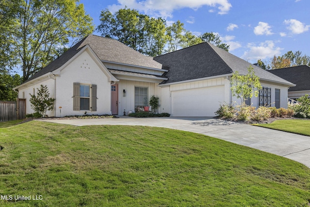 view of front of home featuring a garage and a front lawn