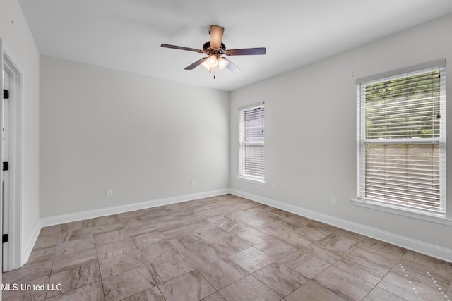 832 Reunion Place Cir, Biloxi, MS 39532 - empty room featuring plenty of natural light, a ceiling fan, and baseboards