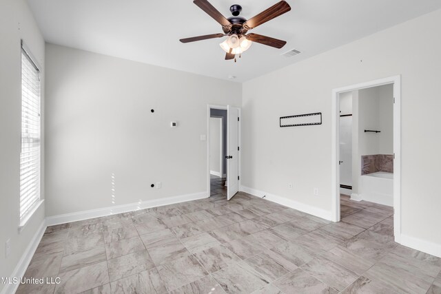 832 Reunion Place Cir, Biloxi, MS 39532 - unfurnished bedroom featuring multiple windows, baseboards, and marble finish flooring