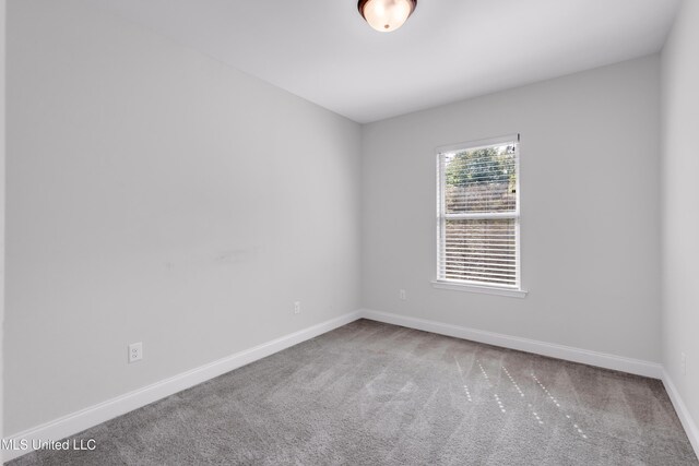 832 Reunion Place Cir, Biloxi, MS 39532 - spare room featuring carpet flooring and baseboards