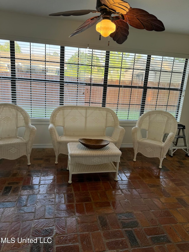 sunroom / solarium with ceiling fan and plenty of natural light