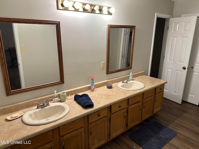 bathroom with vanity and hardwood / wood-style floors