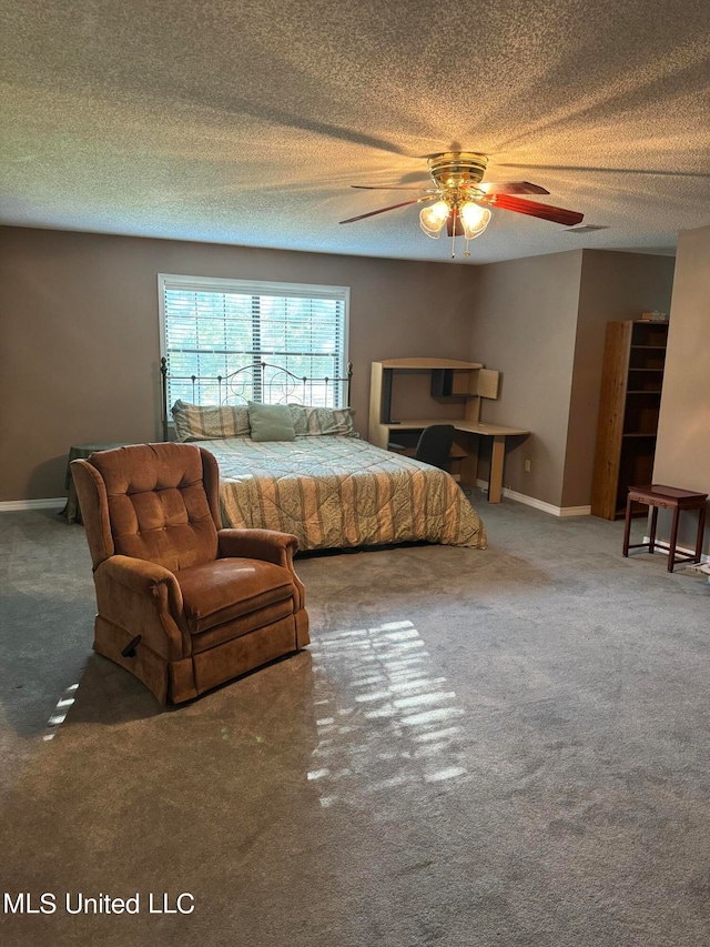 carpeted bedroom with a textured ceiling and ceiling fan