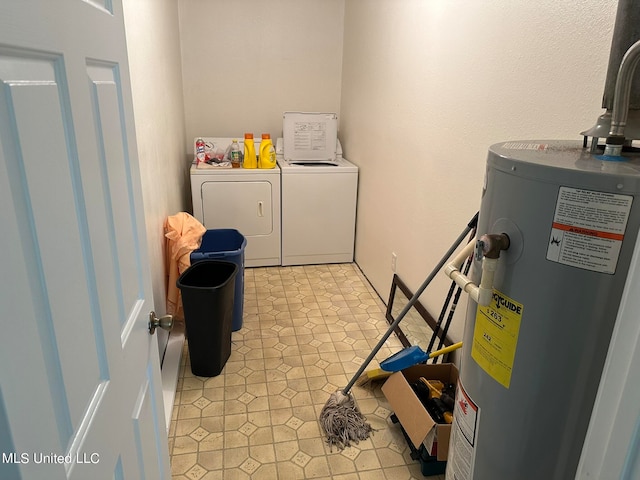 washroom featuring gas water heater and separate washer and dryer