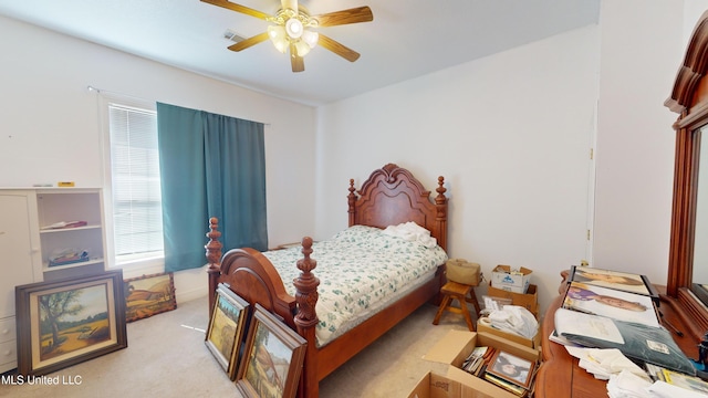 bedroom with light carpet and ceiling fan