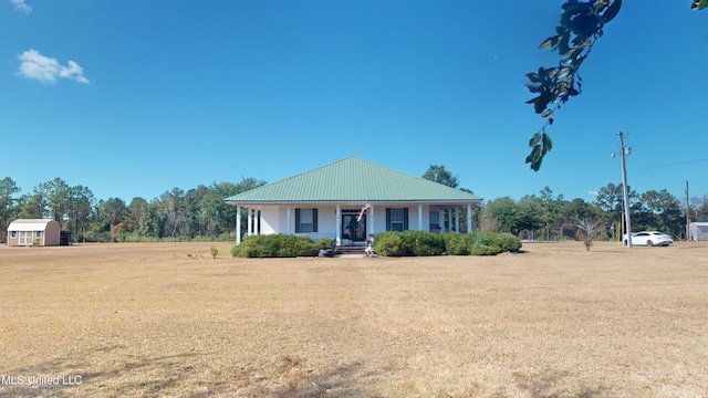 4385 Stringfellow Rd, Lucedale, MS 39452 - view of front of house with a front yard, metal roof, and a porch