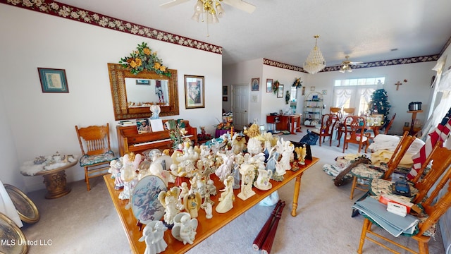 dining room featuring light carpet and ceiling fan